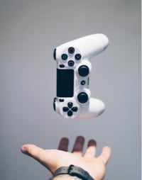 an open hand and a gamepad